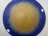 a blue and yellow painting on a white wall