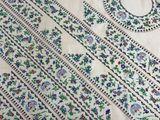 a close up of a table cloth with a pattern on it