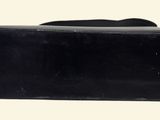 a black piece of luggage that is sitting on a table