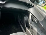 a dashboard of a car with a digital display in the center