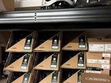 many boxes of cell phones in the trunk of a car