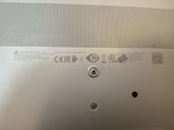 a close up of a metal plate with a button on it