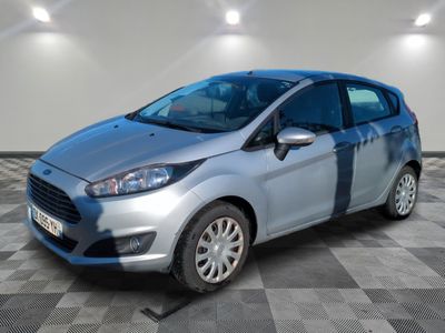the new ford fiesta is parked on a checkered floor