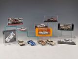 a lot of toy cars on display in a display case