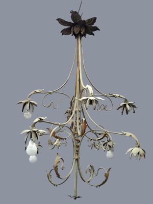 a white chandelier with a bird on top of it