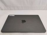 an apple macbook pro laptop computer sitting on top of a white surface