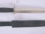 two different types of knives on a white surface