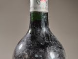 a bottle of wine that is sitting on a table