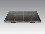 a black table with a glass top and wooden legs