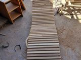 a wooden walkway made out of pallets on the ground