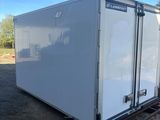 an image of a white trailer parked in a parking lot