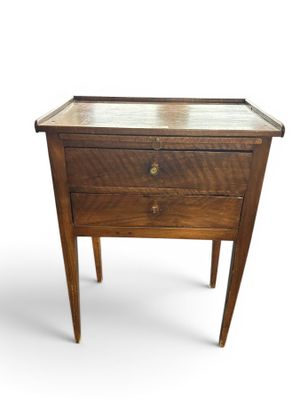 an image of a small table with a drawer on it