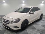 the mercedes cla is parked on a checkered tile floor