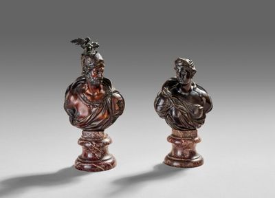 pair of bronze busts of a man and a woman