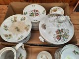many plates and bowls in a box on the table