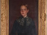 portrait of a young girl in a black dress in a gold frame