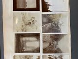 an old photo of a bunch of pictures hanging on a wall
