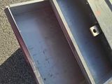 a metal cart with two open drawers on it