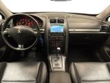 a picture of a car dashboard with a steering wheel and dashboard controls
