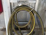a hose that is attached to the side of a wall