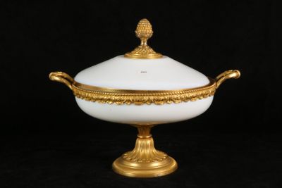 an image of a white and gold covered bowl on a black background