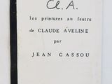 an old book with black writing on it sitting on a table