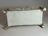 an image of a white and gold plate with flowers on it