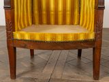 an image of a chair with a yellow and brown striped upholstered seat