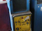 a machine that is sitting next to a blue machine