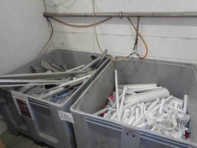 two bins filled with toilet paper in a room