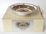 a box with a bowl on top of it on a table