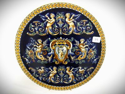 a blue plate with gold and blue designs on it