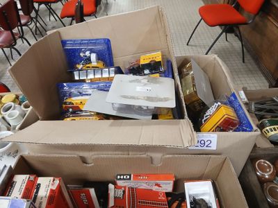 a cardboard box filled with assorted items in a store