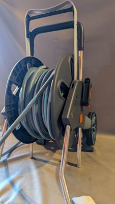 an image of a reel cart with a hose attached to it