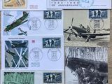 a lot of stamps on a table with a picture of a plane