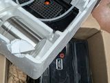 a person holding a box with a device inside of it