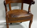 an image of a chair with a leather seat on a white surface