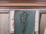 a painting of a naked woman hanging on a wall