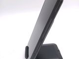 a cell phone that is sitting on top of a stand