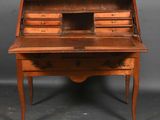 an old wooden desk with drawers and a drawer on top of it