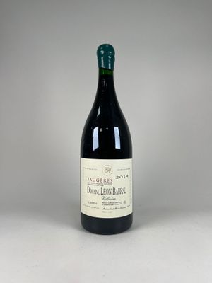 a close up of a bottle of wine on a table