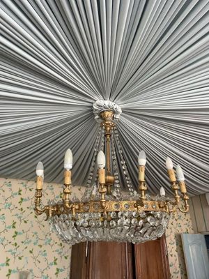 a chandelier hanging from the ceiling in a room