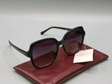 a close up of a pair of sunglasses on a red case