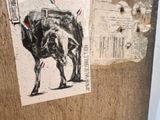 a picture of a picture of a bull on a piece of wood