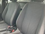 two seats in the back of a car that are grey