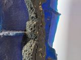 a close up of a blue vase with a crack in it