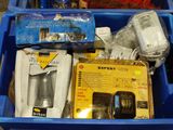 many items in a blue container on the floor