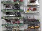 a lot of toy horses and carriages in the display case