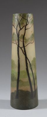 a vase with a painting of trees on it