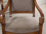 a chair that is sitting in the middle of a room